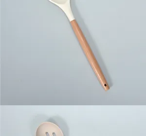 Silicone kitchen spoon detail view, showing the heat-resistant head and solid wood handle.