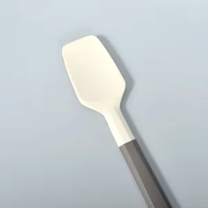 Silicone spatula for baking and cooking with a two-tone handle, cream scraper tool.