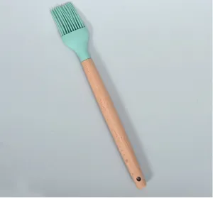 Silicone basting brush with wooden handle kitchen oil brush detail view, heat resistant.