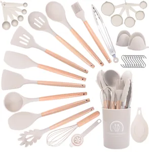 Silicone kitchen utensil set detail showing heat resistant spatulas and spoons holder.