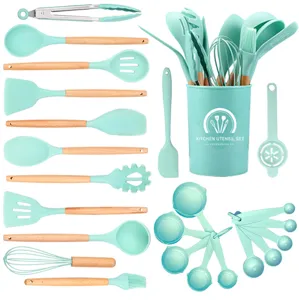 24-piece mint green silicone kitchen utensil set with wooden handles and storage holder.