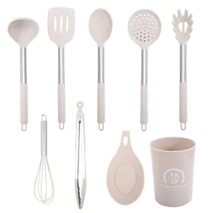 Silicone kitchen utensil set detail showing various cooking tools and holder in white background