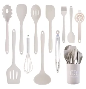 Detailed view of 12-piece silicone kitchen utensil set with heat-resistant tools and holder.