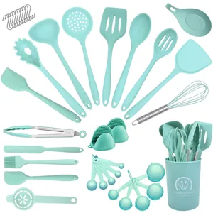 Mint green silicone kitchen utensil set details, showing spatulas, spoons, and storage bucket.