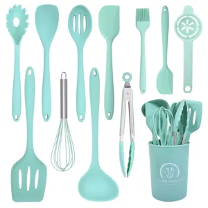 Silicone kitchen utensil set detail showing mint green heat-resistant cooking tools.