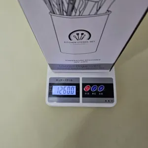 Silicone kitchen utensil set packaging box with heat resistance and weight display detail view.