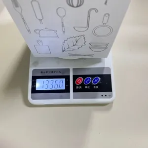 Kitchen digital scale for food weighing, precise measurement display on LCD screen for cooking.