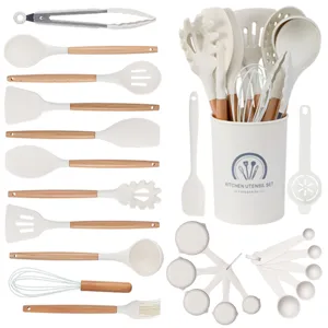 24-piece silicone kitchen utensil set with wooden handles, non-stick cooking tools holder.