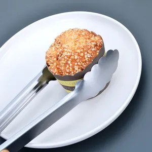 Stainless steel food tong with wooden handle for kitchen barbecue, baking, and cooking use.