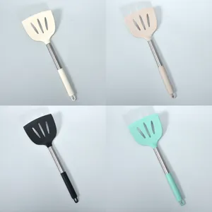 Silicone slotted turner with stainless steel handle, heat resistant cooking spatula for kitchen.