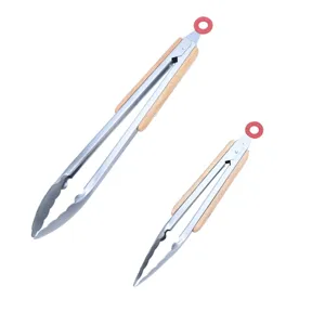 Stainless steel food tongs with wooden handles for outdoor barbecue, camping, and kitchen cooking.