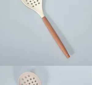 Silicone slotted spoon detail showing heat-resistant head and solid wood handle design.