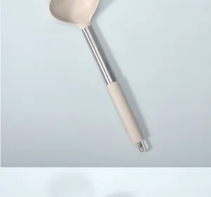 Stainless steel handle silicone soup ladle, heat resistant kitchen cooking tool detail view.
