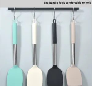 Stainless steel handle silicone spatula for non-stick pan, high temperature cooking utensil detail.