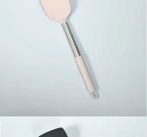 Stainless steel handle silicone cooking spatula detail, heat resistant tool for nonstick pan.