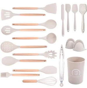 19-piece heat resistant silicone kitchen utensil set with natural wooden handles for cooking.
