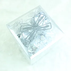 Clear transparent gift box filled with 32 silver Christmas tree hanging pendants and decorative baubles.