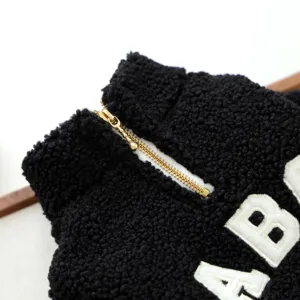 Black fuzzy pet fleece jacket detail view, soft cozy warm winter puppy coat zipper.