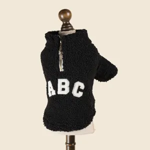 Pet fleece coat detail view, black warm winter pet apparel with half-zip and ABC letter.