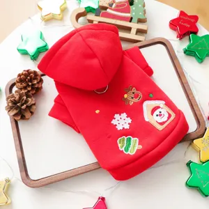 Christmas pet hoodie detail featuring cute embroidered santa and reindeer on soft red fabric.