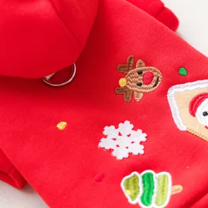 Close-up of red pet hoodie featuring cute Christmas embroidery, soft fabric and detailed stitch.