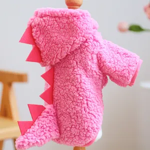Pink fluffy pet dinosaur hoodie closeup, warm winter fleece apparel for small dogs and puppies.