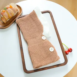 Cute pet knitted hat with buttons and wood-ear edge, warm winter accessory for dogs and cats.