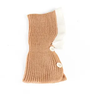 Cute knitted pet hat with ruffle trim and buttons, cozy winter accessory for small dogs and cats.