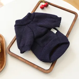 Dark blue pet knitted sweater for small dogs and cats, cozy winter pet apparel with label.