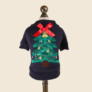 Detail shot of a cozy dark blue pet sweater featuring a cute knitted Christmas tree and a red bow.