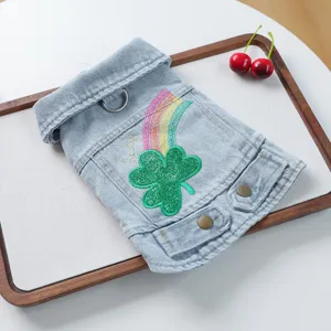 Detailed view of cute pet denim jacket featuring glitter clover and rainbow embroidery for small dogs.