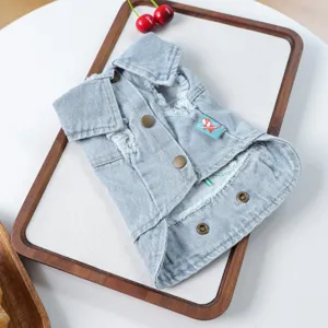 Cute small dog denim vest puppy autumn winter pet clothes with lapel and vintage distressed design.