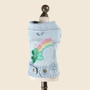 Close-up detail of pet denim jacket with glitter four-leaf clover, rainbow patch and D-ring.