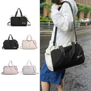 Details showing the wet dry separation nylon travel fitness bag with shoulder strap in action.