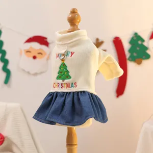 Cute Christmas dog dress with tree embroidery and denim skirt, perfect for holiday pet party.