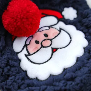 Pet winter fleece clothing detail, cute Santa Claus embroidered patch, warm navy blue puppy outfit