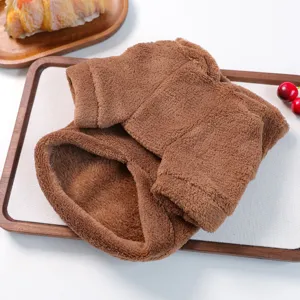 Brown plush pet clothing detail shot, soft fleece puppy hoodie fabric and texture close-up.