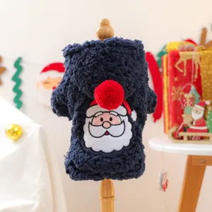 Close-up detail of navy blue plush pet hoodie with Santa Claus embroidery and cute red pom-pom.