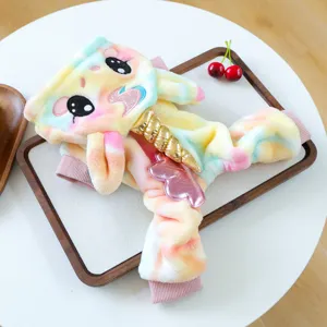 Detailed view of colorful plush unicorn pet hoodie costume with golden horn for small dogs.