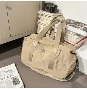 Large capacity canvas duffel bag for travel and gym, lightweight beige shoulder bag detail.