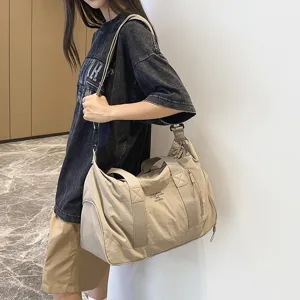 Large capacity duffel bag for sports and travel, lightweight and stylish canvas tote.