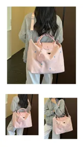 Pink large capacity travel shoulder bag with cute blue embroidery, casual commuter tote.