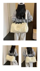 Detail view of the large capacity travel duffel bag with shoe compartment and wet dry separation.