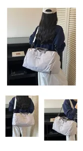 Large capacity travel duffel bag with wet dry separation and shoulder strap for gym and fitness.