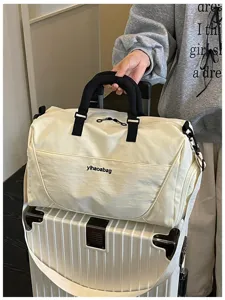 Large capacity travel duffel bag with shoe compartment, lightweight gym and weekend bag.