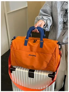 Large capacity travel duffel bag with crossbody strap, ideal for short trips and gym use.