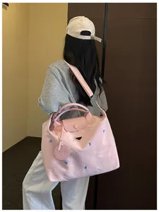 Large capacity pink canvas travel shoulder bag casual commuter handbag with embroidery details