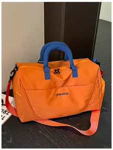 Large capacity travel duffel bag with shoe compartment, portable gym bag for sports and short trips.