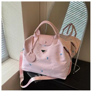 Pink large capacity travel duffel bag with bow embroidery, portable shoulder luggage bag for gym.