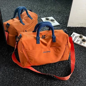 Large capacity travel duffel bag with stylish orange and blue design for gym and weekend trips.